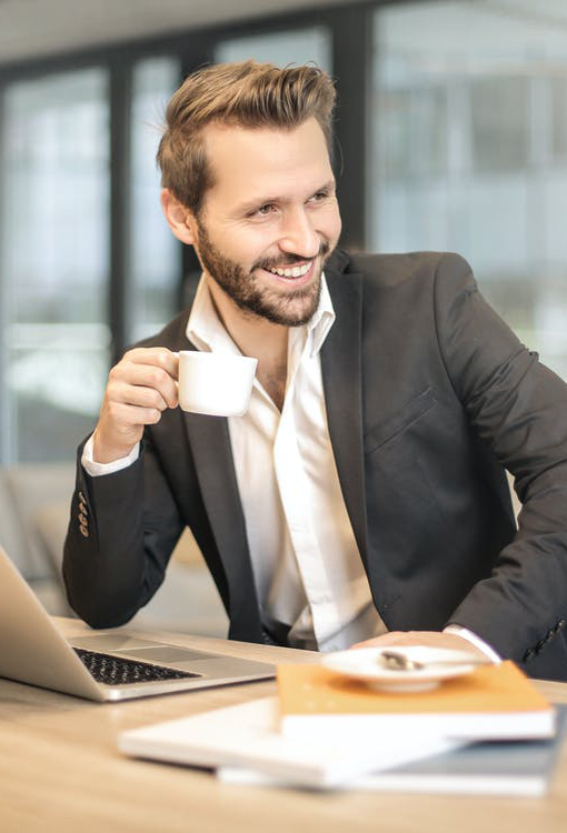 Guy smiling with cup